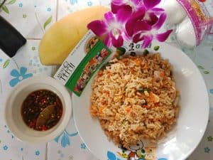 Fried rice with salted egg by Thai home cooking. Vegetarian meal with egg.