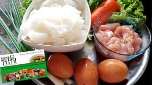 stir fried rice noodle with chicken and eggs by Thai home cooking